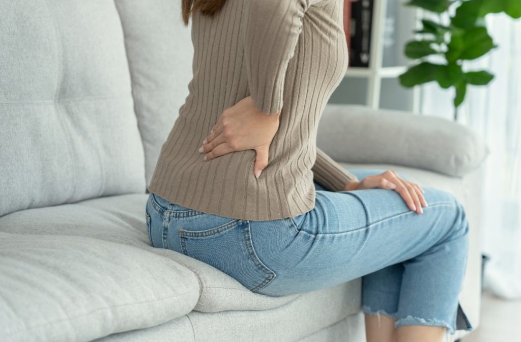a woman experiencing back pain